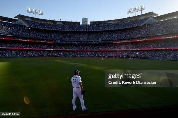 Clayton Kershaw of the Los Angeles Dodgers stands in the outfield before game one of the 2017 World Series against the Houston Astros at Dodger...