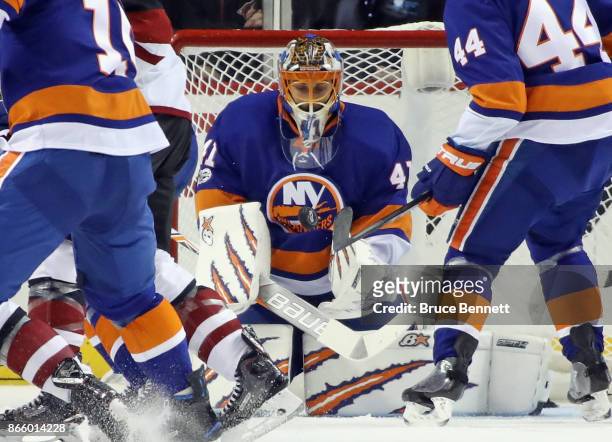 Jaroslav Halak of the New York Islanders makes the chest save during the second period against the Arizona Coyotes at the Barclays Center on October...