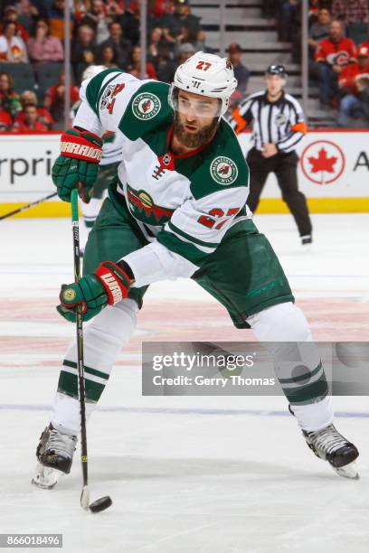 Kyle Quincey of the Minnesota Wild looks for a pass in an NHL game against of the Calgary Flames at the Scotiabank Saddledome on October 21, 2017 in...