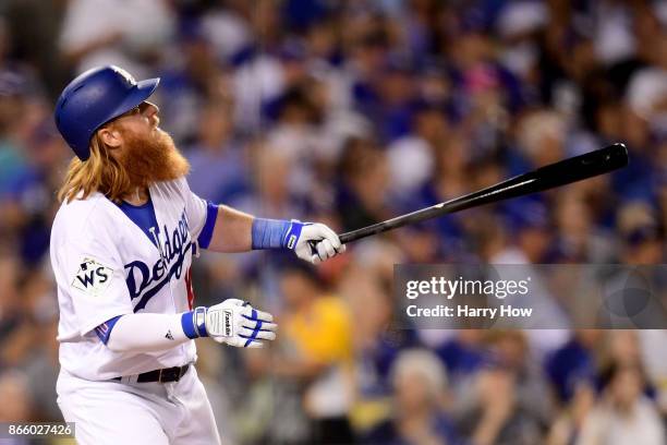 Justin Turner of the Los Angeles Dodgers reacts after hitting a two-run home run during the sixth inning against the Houston Astros in game one of...