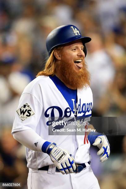 Justin Turner of the Los Angeles Dodgers celebrates after hitting a two-run home run during the sixth inning against the Houston Astros in game one...