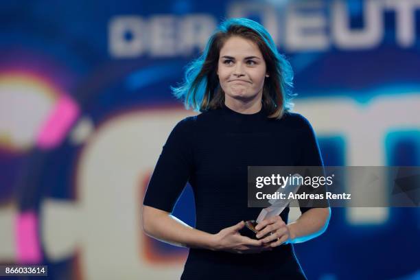 Hazel Brugger receives her award for 'Best Newcomer' during the 21st Annual German Comedy Awards on October 24, 2017 in Cologne, Germany