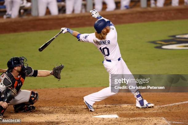Justin Turner of the Los Angeles Dodgers hits a two-run home run during the sixth inning against the Houston Astros in game one of the 2017 World...