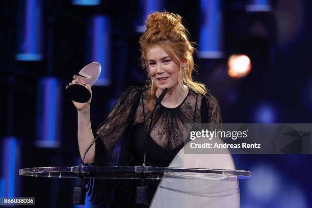 Palina Rojinski receives her award for 'Best Cinema Comedy' during the 21st Annual German Comedy Awards on October 24, 2017 in Cologne, Germany