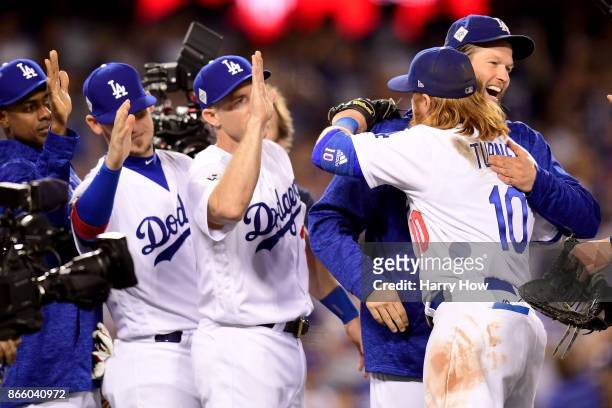 Clayton Kershaw celebrates with Justin Turner of the Los Angeles Dodgers after defeating the Houston Astros 3-1 in game one of the 2017 World Series...