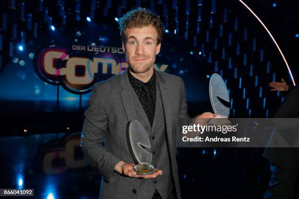 Luke Mockridge poses with his awards for 'Best Comedy Show and Best Live-Act' during the 21st Annual German Comedy Awards on October 24, 2017 in...