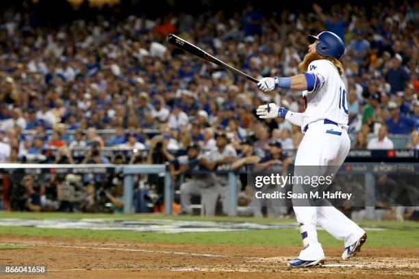 Justin Turner of the Los Angeles Dodgers reacts after hitting a two-run home run during the sixth inning against the Houston Astros in game one of...