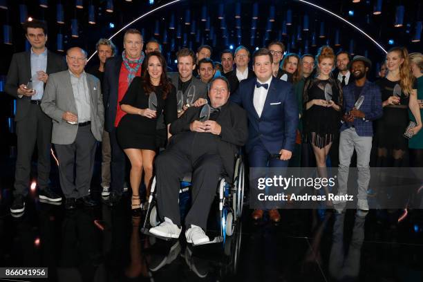 Ottfried Fischer poses with the Honorary Award beside the other Award winners as Carolin Kebekus, Luke Mockridge and Hape Kerkeling and Chris Tall...