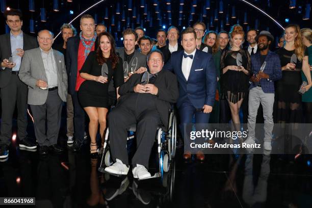 Ottfried Fischer poses with the Honorary Award beside the other Award winners as Carolin Kebekus, Luke Mockridge and Hape Kerkeling and Chris Tall...