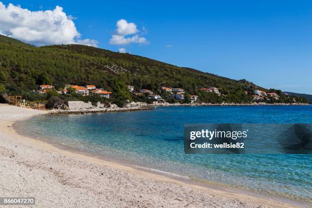 sand and shingle beach at prizba - korcula island stock pictures, royalty-free photos & images