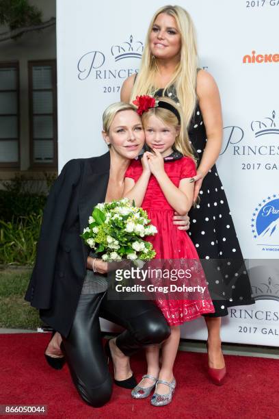 Her Serene Highness Princess Charlene of Monaco is greeted with flowers by Maxwell Johnson and Jessica Simpson at the 2017 Princess Grace Awards Gala...