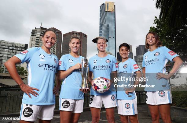 Kyah Simon, Steph Catley, Alanna Kennedy, Yukari Kinga and Ashley Hatch of Melbourne City Womens team pose with the W-League trophy during a...