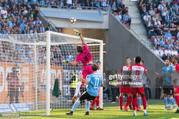 Goalkeeper Fabian Giefer of Augsburg , Christian Koeppel of 1860 Muenchen , Bernard Mwarome of Augsburg battle for the ball during the Regionalliga...