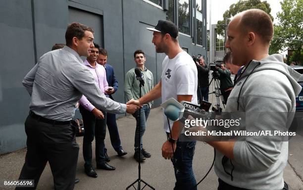 Travis Cloke shakes hands with media after announcing his retirement at Nike on October 25, 2017 in Melbourne, Australia.