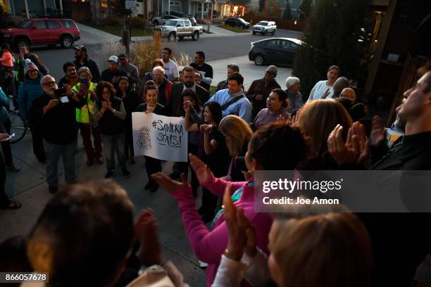 Sandra Lopez-Munoz of Silt, CO, and her daughter Areli Gonzalez-Lopez almost 2, are welcomed into sanctuary with the Two Rivers Unitarian...