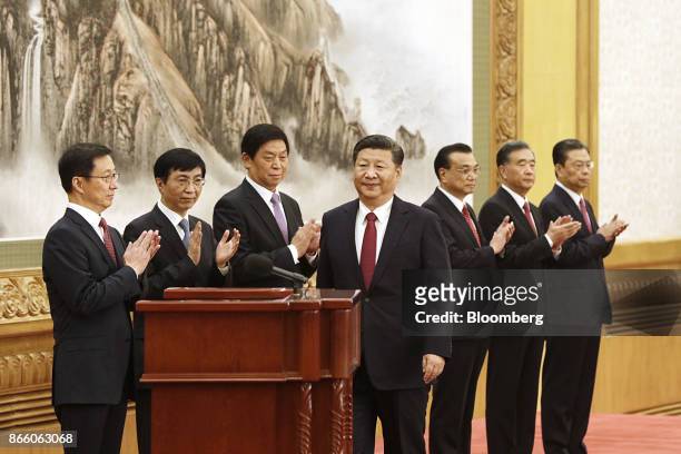Xi Jinping, China's president and general secretary of the Communist Party of China, center, approaches the podium as other members of the Communist...