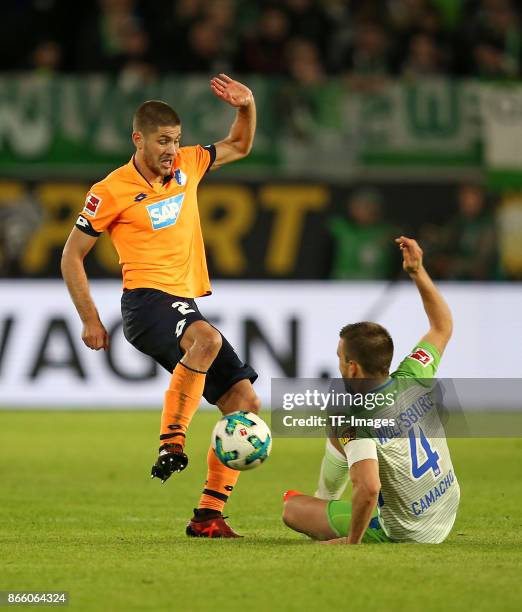 Andrej Kramaric of Hoffenheim and Ignacio Camacho of Wolfsburg battle for the ball during the Bundesliga match between VfL Wolfsburg and TSG 1899...