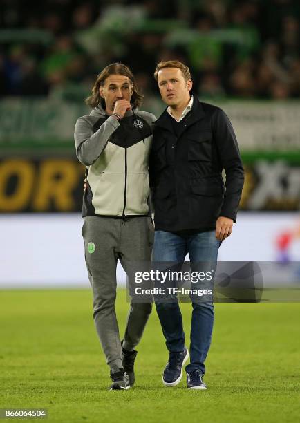 Head coach Martin Schmidt of Wolfsburg and Olaf Rebbe of Wolfsburg looks on during the Bundesliga match between VfL Wolfsburg and TSG 1899 Hoffenheim...