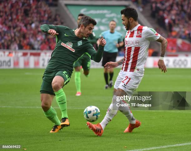 Fin Bartels of Bremen and Leonardo Bittencourt of Koeln battle for the ball during the Bundesliga match between 1. FC Koeln and SV Werder Bremen held...