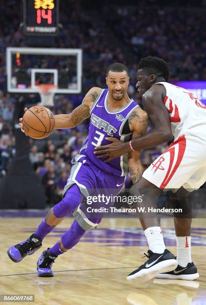 George Hill of the Sacramento Kings drives towards the basket on Clint Capela of the Houston Rockets during an NBA basketball game at Golden 1 Center...