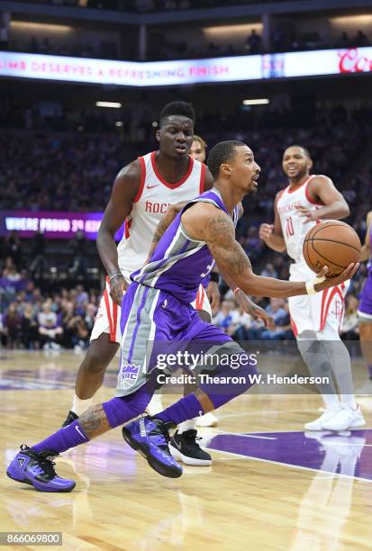 George Hill of the Sacramento Kings drives towards the basket on Clint Capela of the Houston Rockets during an NBA basketball game at Golden 1 Center...