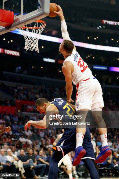 Blake Griffin of the LA Clippers dunks over Rudy Gobert of the Utah Jazz at the Staples Center on October 24, 2017 in Los Angeles, California.
