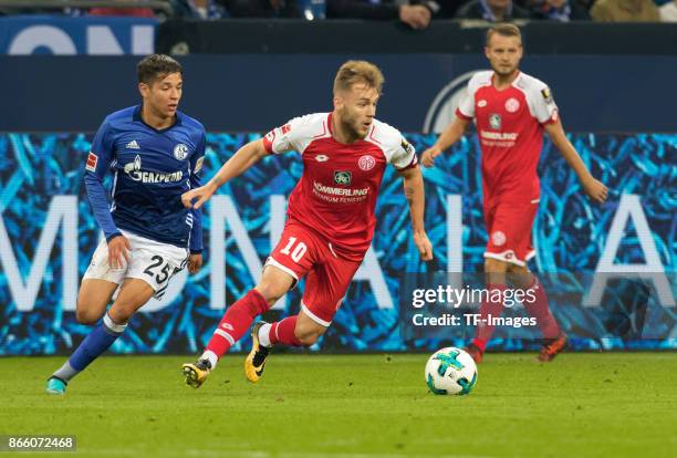 Amine Harit of Schalke and Alexandru Maxim of Mainz battle for the ball during the Bundesliga match between FC Schalke 04 and 1. FSV Mainz 05 at...