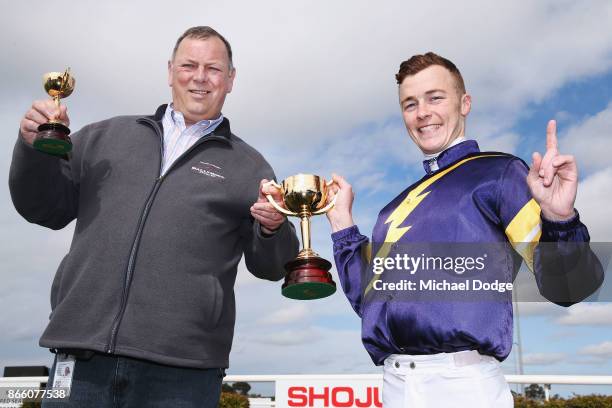 Vengeur Masque trainer Mike Moroney and jockey Patrick Moloney pose with their trophies after winning race 7 the bet365 Geelong Cup ahead of Craig...