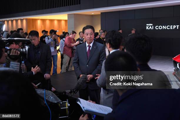 Mazda Motor Co CEO Masamichi Kogai responds to questions from media reporters after a press conference at the Mazda Motor Co booth during the Tokyo...