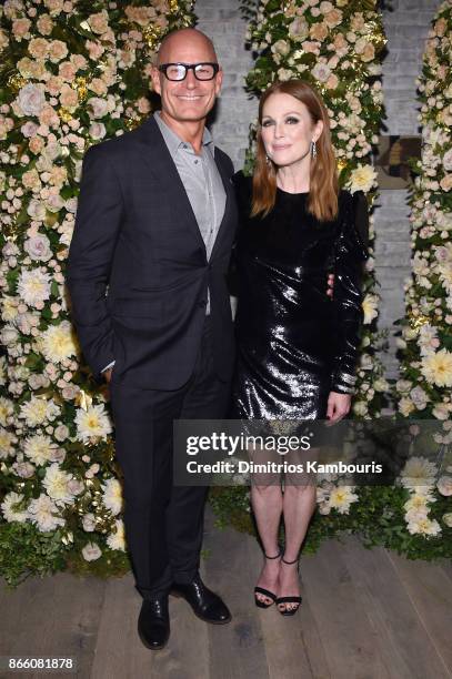 John Hardy CEO, Robert Hanson, and actress Julianne Moore, wearing John Hardy jewelry, attend John Hardy And Vanity Fair Celebrate Legends at Le...