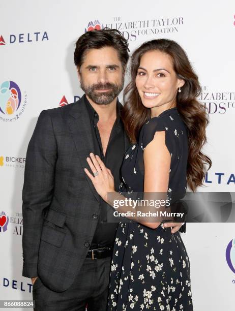 John Stamos and Caitlin McHugh attend The Elizabeth Taylor AIDS Foundation and mothers2mothers dinner at Ron Burkle's Green Acres Estate on October...