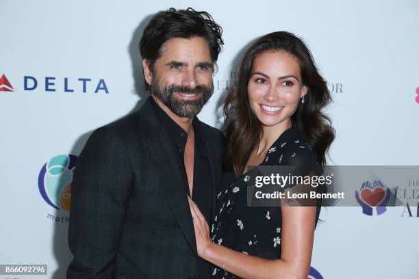 Actor John Stamos and fiancee Caitlin McHugh attends the Zac Posen And Paris Jackson Host Event Supporting mothers2mothers And ETAF on October 24,...