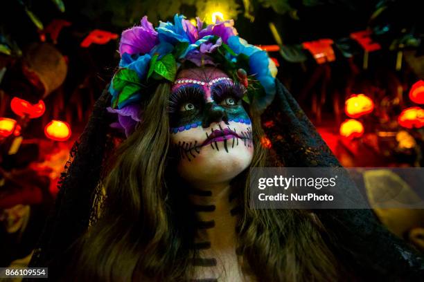 Girl with fantasy and catrina makeup shakes up transeuentes and consumers at Ladeira Porto Geral on 24 October 2017 in Sao Paulo, Brazil. La Catrina...