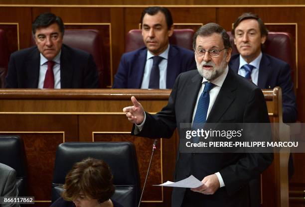 Spain's Prime Minister Mariano Rajoy gives a speech during a session of the Lower House of Parliament in Madrid on October 25, 2017. Spain ramped up...