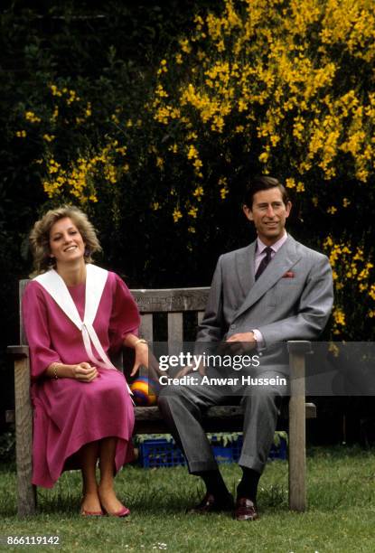Prince Charles, Prince of Wales and Diana, Princess of Wales, while 6 months pregnant with Prince Harry and wearing a pink sailor style dress with a...