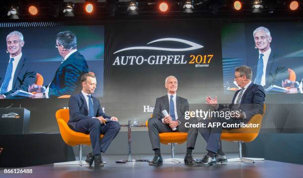 Of Volkswagen AG Matthias Mueller talks with Gabor Steingart , publisher of German economy paper Handelsblatt, and the paper's chief editor Sven...