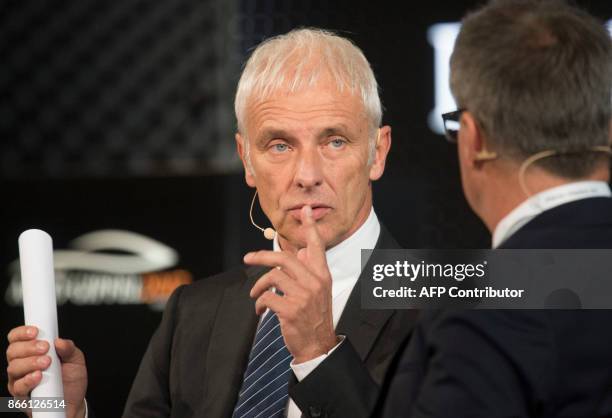 Of Volkswagen AG Matthias Mueller talks with Gabor Steingart, publisher of German economy paper Handelsblatt, during the Auto Gipfel 2017 at the...