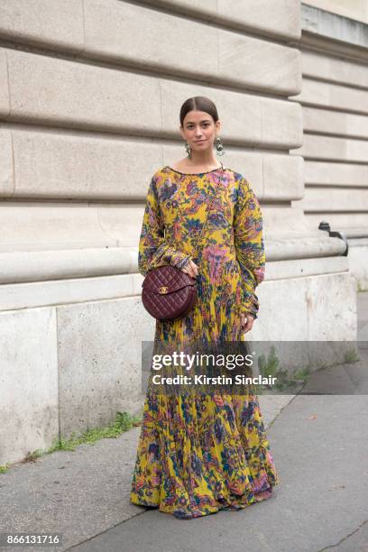 Accessories Director at Harper's Bazaar Amanda Alagem wears an Etro dress and a Chanel bag"n day 2 of Paris Womens Fashion Week Spring/Summer 2018,...