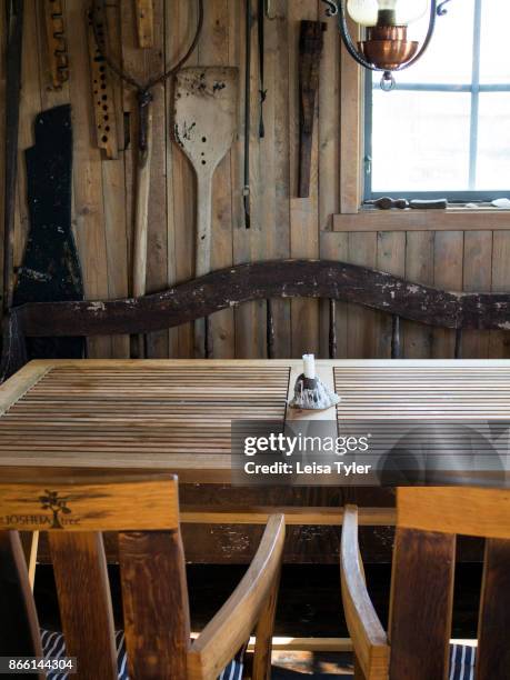 Dining table inside Everts Sjöbods, a 19th century boathouse in Grebbestad, West Sweden which is used to run a small travel business offering oyster...