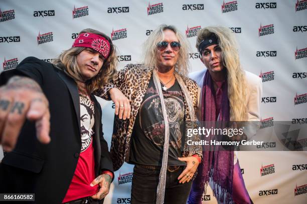 Stix Zadina, Michael Starr and Lexxi Foxx of the band Steel Panther attend the Loudwire Music Awards at The Novo by Microsoft on October 24, 2017 in...