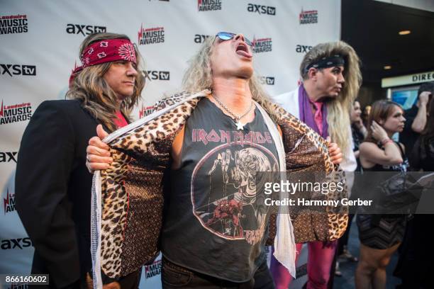 Stix Zadina, Michael Starr and Lexxi Foxx of the band Steel Panther attend the Loudwire Music Awards at The Novo by Microsoft on October 24, 2017 in...