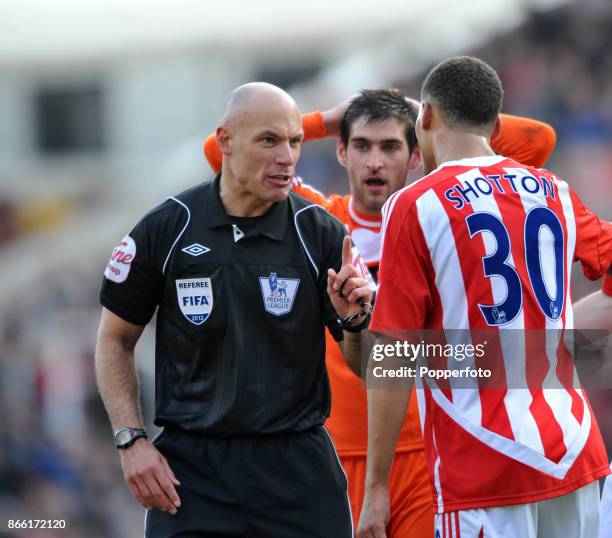 Referee Howard Webb talks to Ryan Shotton of Stoke City during the Barclays Premier League match between Stoke City and Swansea City at The Britannia...