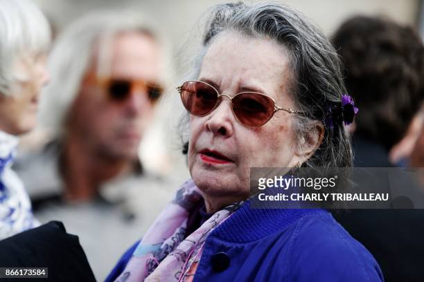 French actress Dominique Lavanant walks with others as they attend the funeral service of the French actress Danielle Darrieux in Bois-le-Roi,...