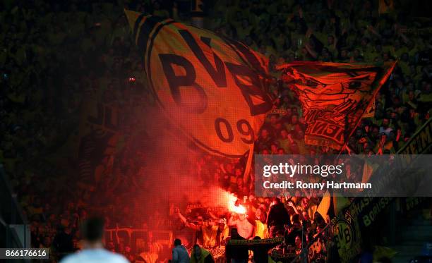 Supporters of Dortmund handle pyrotechnics during the DFB Cup match between 1. FC Magdeburg and Borussia Dortmund at MDCC-Arena on October 24, 2017...