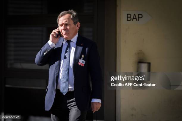 Francis Szpiner, French lawyer of Paris Saint-Germain president and BeIN Media chief Nasser al-Khelaifi, phones outside the offices of Swiss attorney...