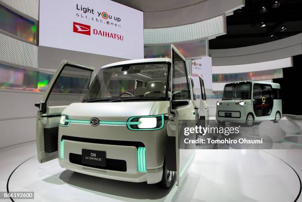 Daihatsu Motor Co.'s DN U-Space, left, and DN Pro Cargo concept vehicles are seen during the Tokyo Motor Show at Tokyo Big Sight on October 25, 2017...