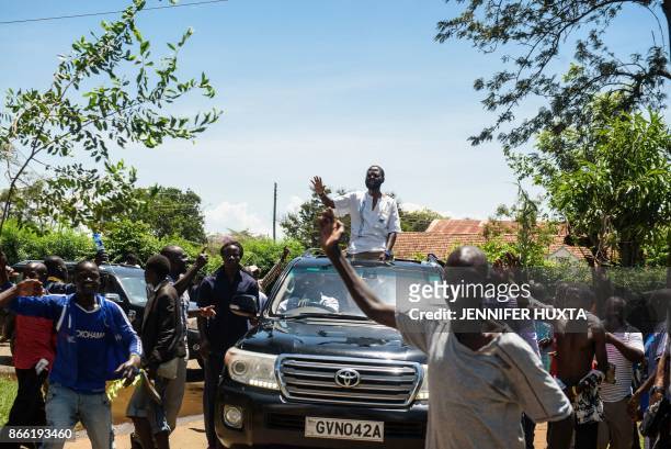 Governor Anyang Nyang'o waves from the car as he arrives to address Kenyan opposition protestors at the Independent Electoral and Boundaries...