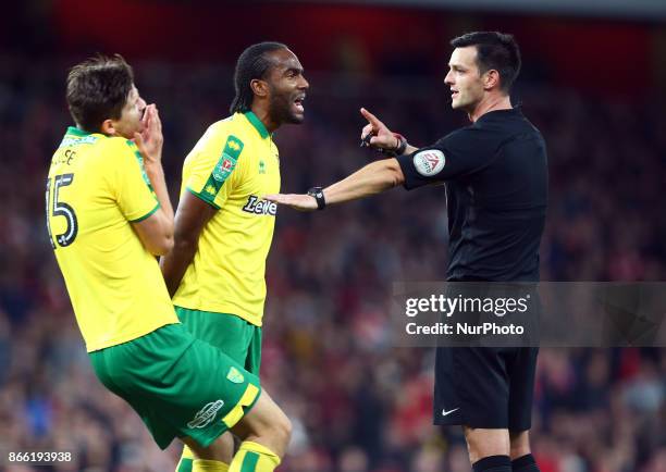 Cameron Jerome of Norwich City not happy with Referee Andy Madley during Carabao Cup 4th Round match between Arsenal and Norwich City at Emirates...