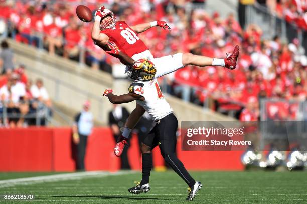 Troy Fumagalli of the Wisconsin Badgers is defended by Darnell Savage Jr. #4 of the Maryland Terrapins during the second quarter at Camp Randall...