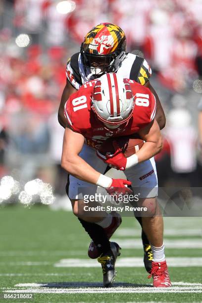 Troy Fumagalli of the Wisconsin Badgers is brought down by Darnell Savage Jr. #4 of the Maryland Terrapins during a game at Camp Randall Stadium on...